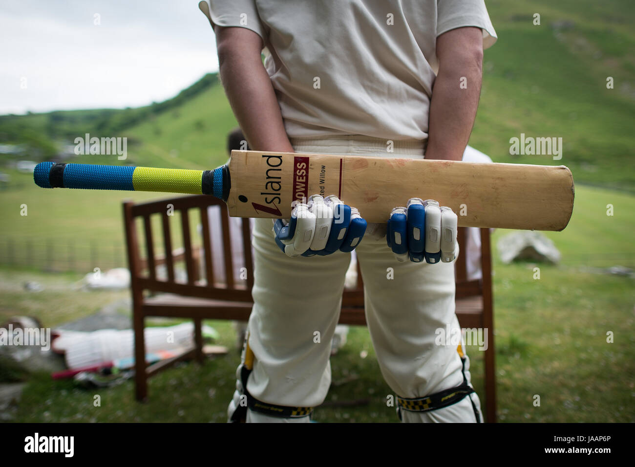 A batsman waits for his turn during an annual friendly match between Cravens Cavaliers and Lynton & Lynmouth Cricket Club at their ground based inside the Valley of Rocks, North Devon. Stock Photo