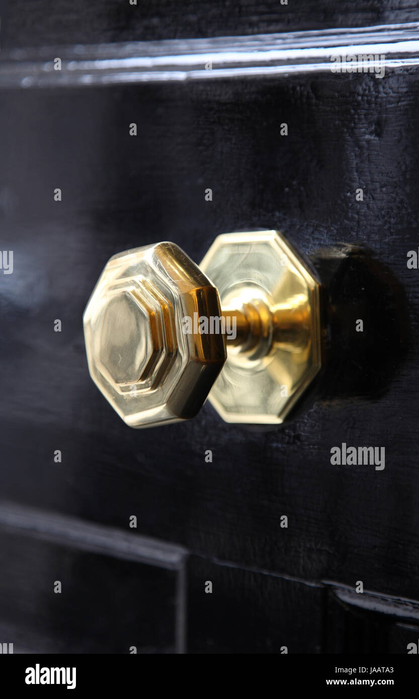 A typically British brass door knob on a front door on a central London street, UK Stock Photo