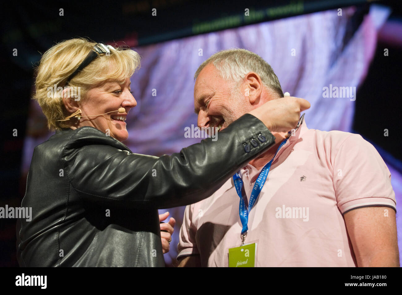 Jo Malone perfumer trying out a fragrance on a member of the audience on stage at Hay Festival 2017 Hay-on-Wye Powys Wales UK Stock Photo