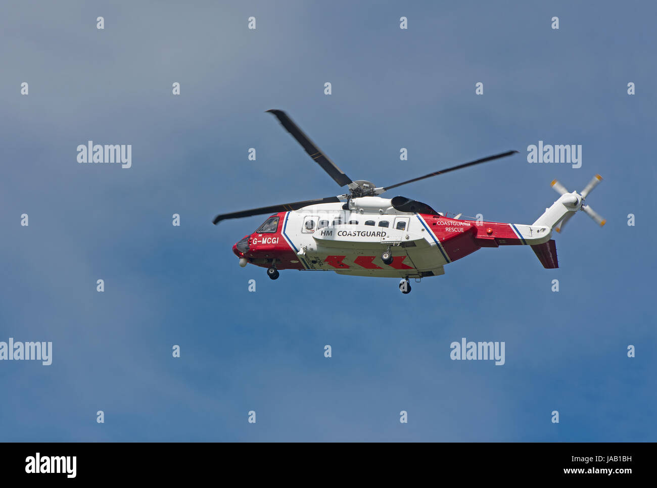Coastguard helicopter departing from home base at Inverness Airport on an emergency call out. Stock Photo