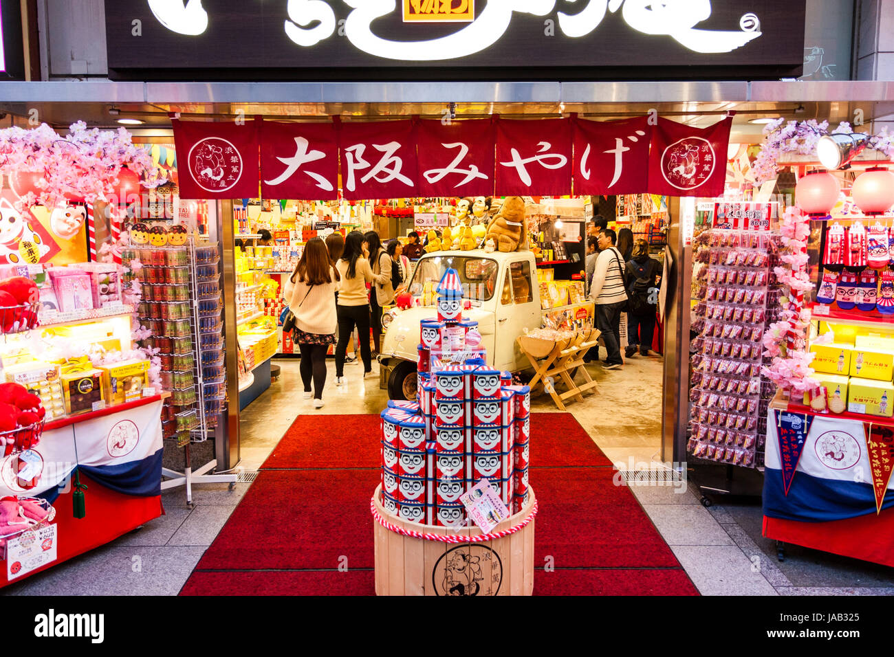 Japan, Osaka, Dotonbori. Night time. Front of souvenir store, selling