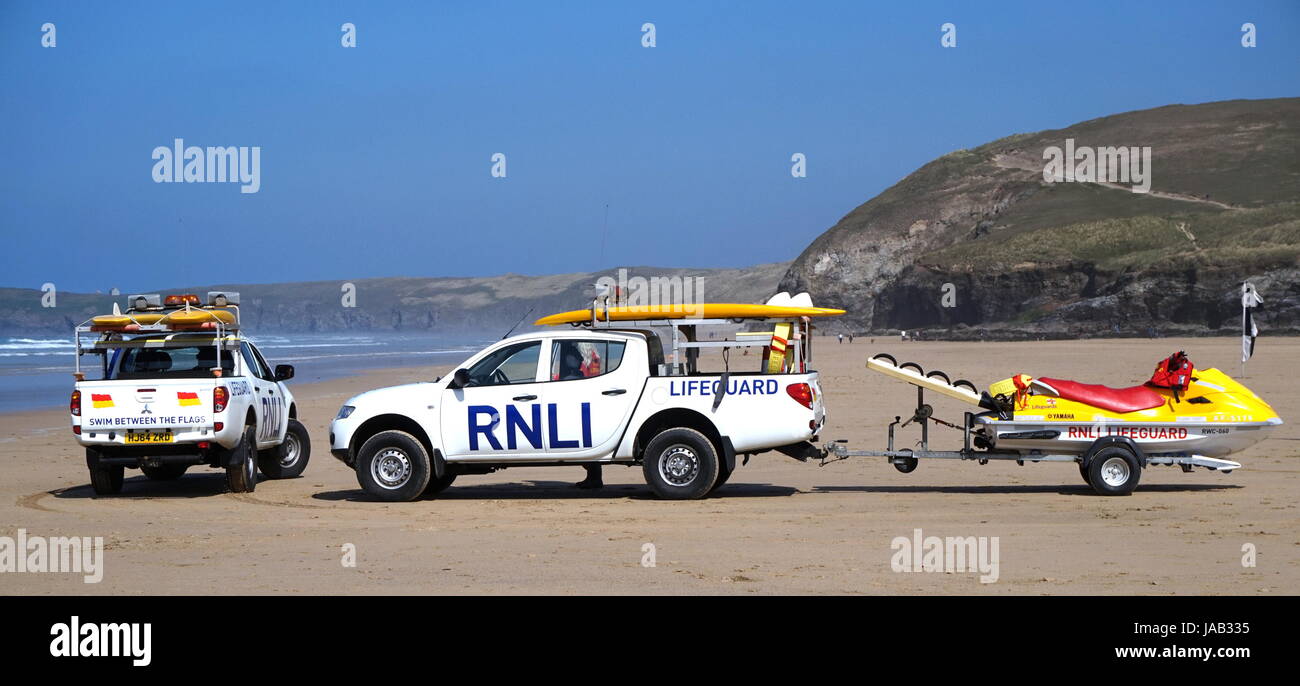 Newquay, Cornwall, UK - April 7 2017: RNLI Lifeguard trucks and jetski on a Cornish surfing beach at Newquay Stock Photo