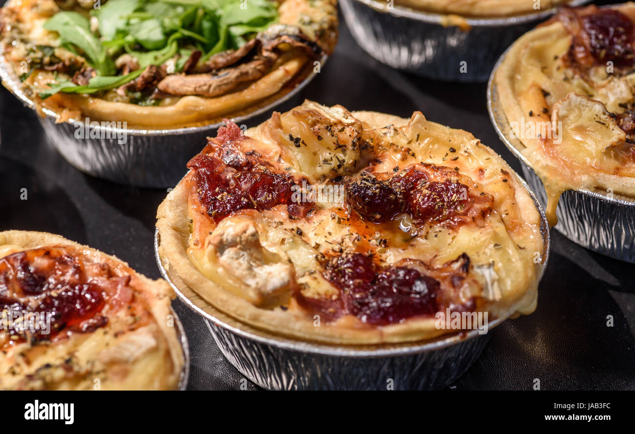 Brie and cranberry tartlets. Stock Photo
