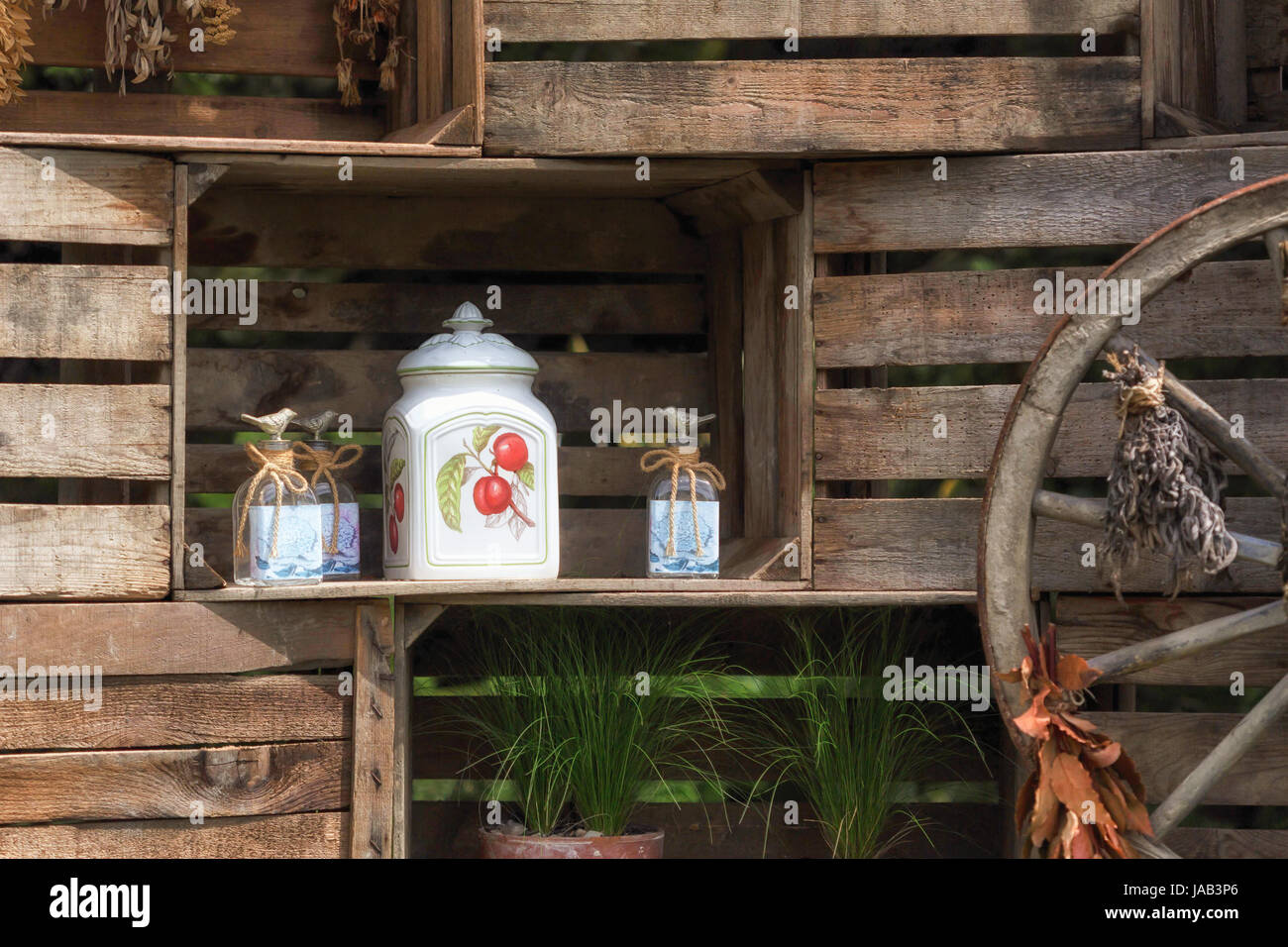 Pots In Wooden Crates With A Char Wheel In Decoration Stock Photo
