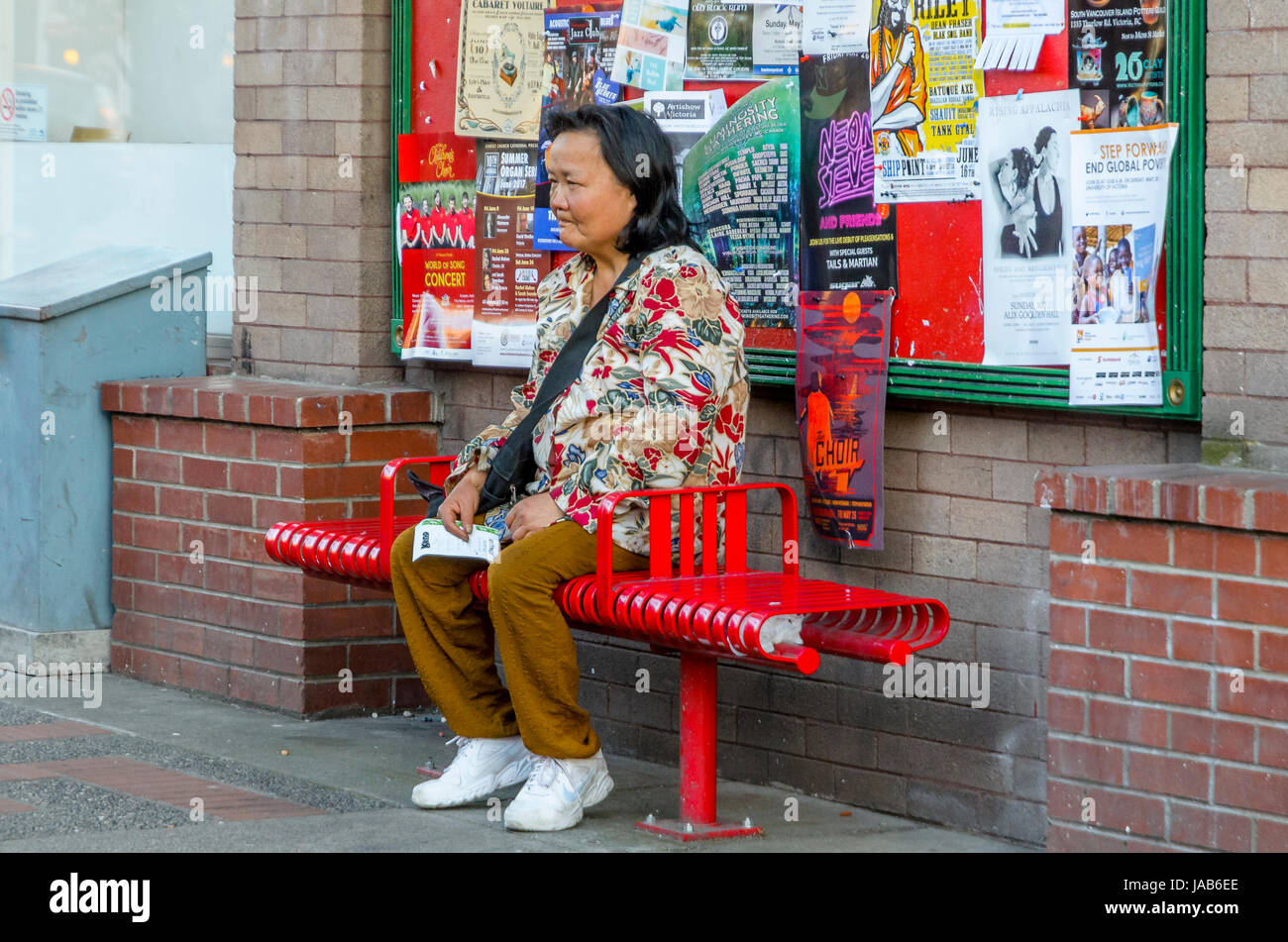 Woman with lottery ticket looking a little dejected. Stock Photo