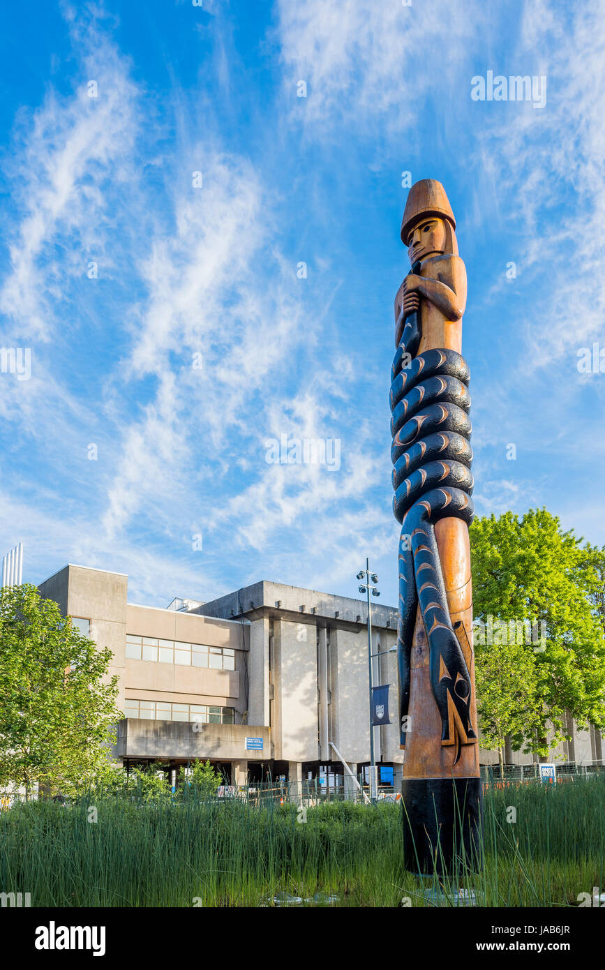 Musqueam Post carved by  Musqueam artist, Brent Sparrow Jr., the post tells an origin story of the Musqueam involving a two-headed serpent, University Stock Photo
