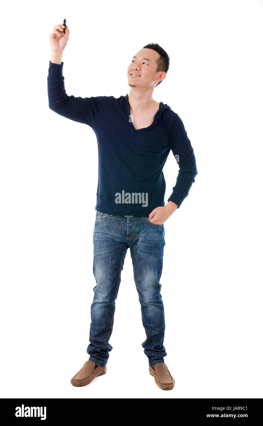 asian male writing something on glass board with marker Stock Photo - Alamy