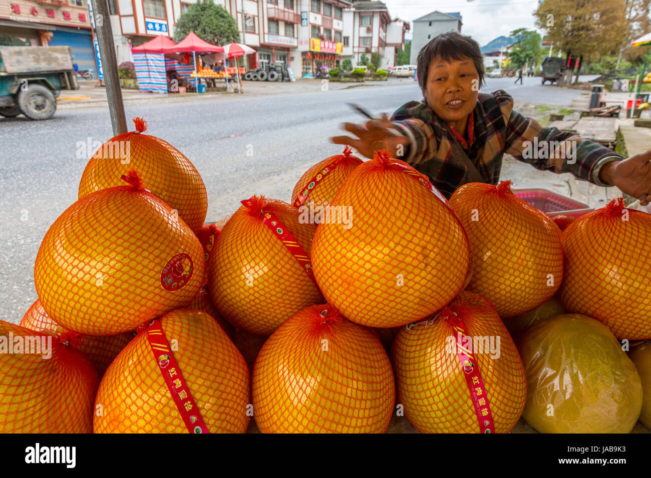Guangxi, China.  Between Yangshuo and Longji.  Pomelos for sale at Roadside Rest Stop. Stock Photo