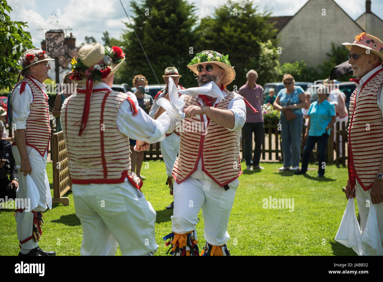 Thaxted Morris Weekend 3-4 June 2017 A meeting of member clubs of the Morris Ring celebrating the 90th anniversary of the founding of the Thaxted Morris Dancing side or team in Thaxted, North West Essex, England UK.  The Thaxted Morris side dancing and drinking beer at The Horse and Groom pub at Cornish Hall End, Essex. Hundred of Morris dancers from the UK and this year the Silkeborg side from Denmark spend most of Saturday dance outside pubs in nearby villages where much beer is consumed. In the late afternoon all the sides congregate in Thaxted where massed dancing is perfomed along Town St Stock Photo