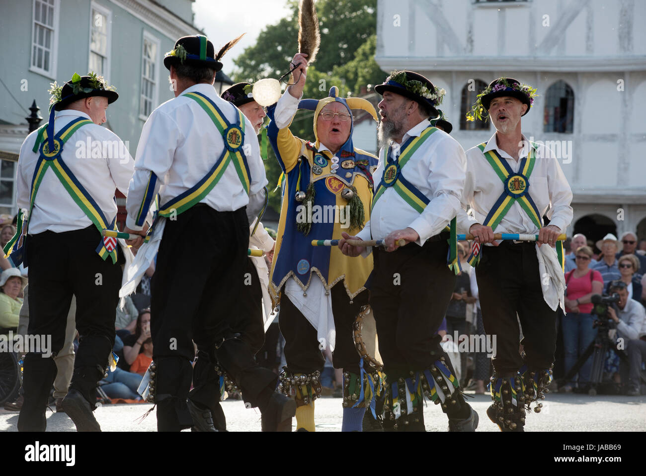 Thaxted Morris Weekend 3-4 June 2017 A meeting of member clubs of the Morris Ring celebrating the 90th anniversary of the founding of the Thaxted Morris Dancing side or team in Thaxted, North West Essex, England UK.  Long Man side side perfom in Town Street Thaxted Essex during the early evening mass dancing through the town. Hundred of Morris dancers from the UK and this year the Silkeborg side from Denmark spend most of Saturday dance outside pubs in nearby villages where much beer is consumed. In the late afternoon all the sides congregate in Thaxted where massed dancing is perfomed along T Stock Photo