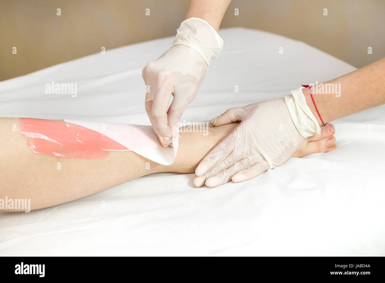 Meat Depilation Process depilation female legs and hands in a beauty salon Stock Photo ...