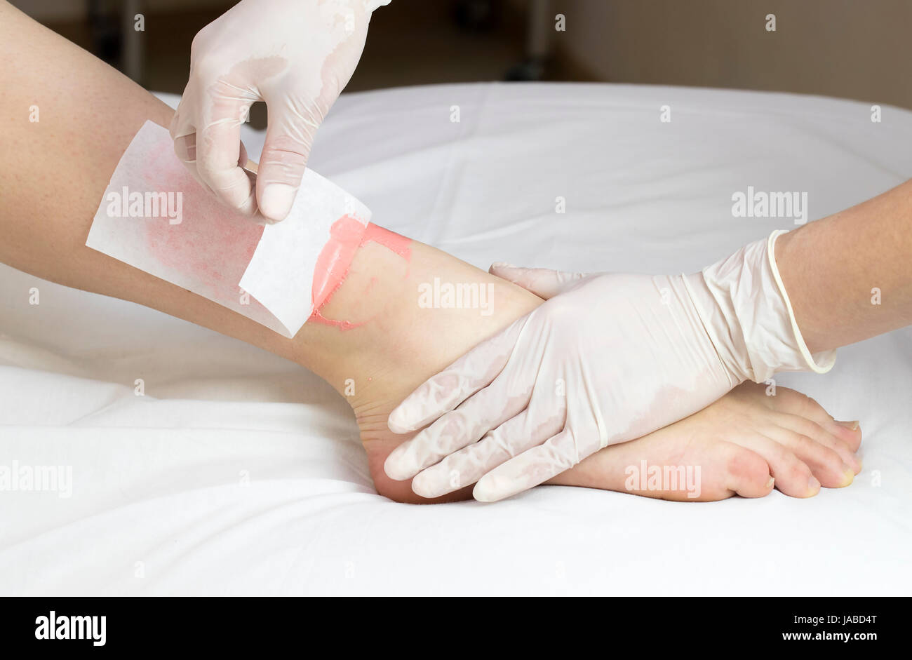 Process depilation female legs and hands in a beauty salon Stock Photo