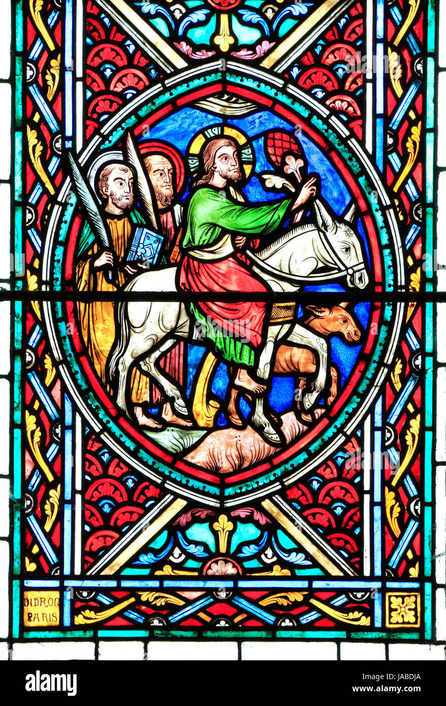 Jesus Christ rides into Jerusalem on a donkey, with two disciples, Palm Sunday, Passion Window by Adolph Didron, 1860, stained glass, Feltwell church Stock Photo