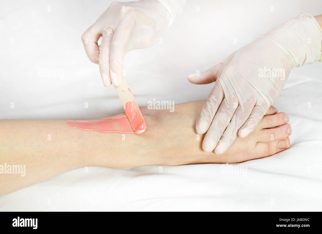 Process depilation female legs and hands in a beauty salon Stock Photo