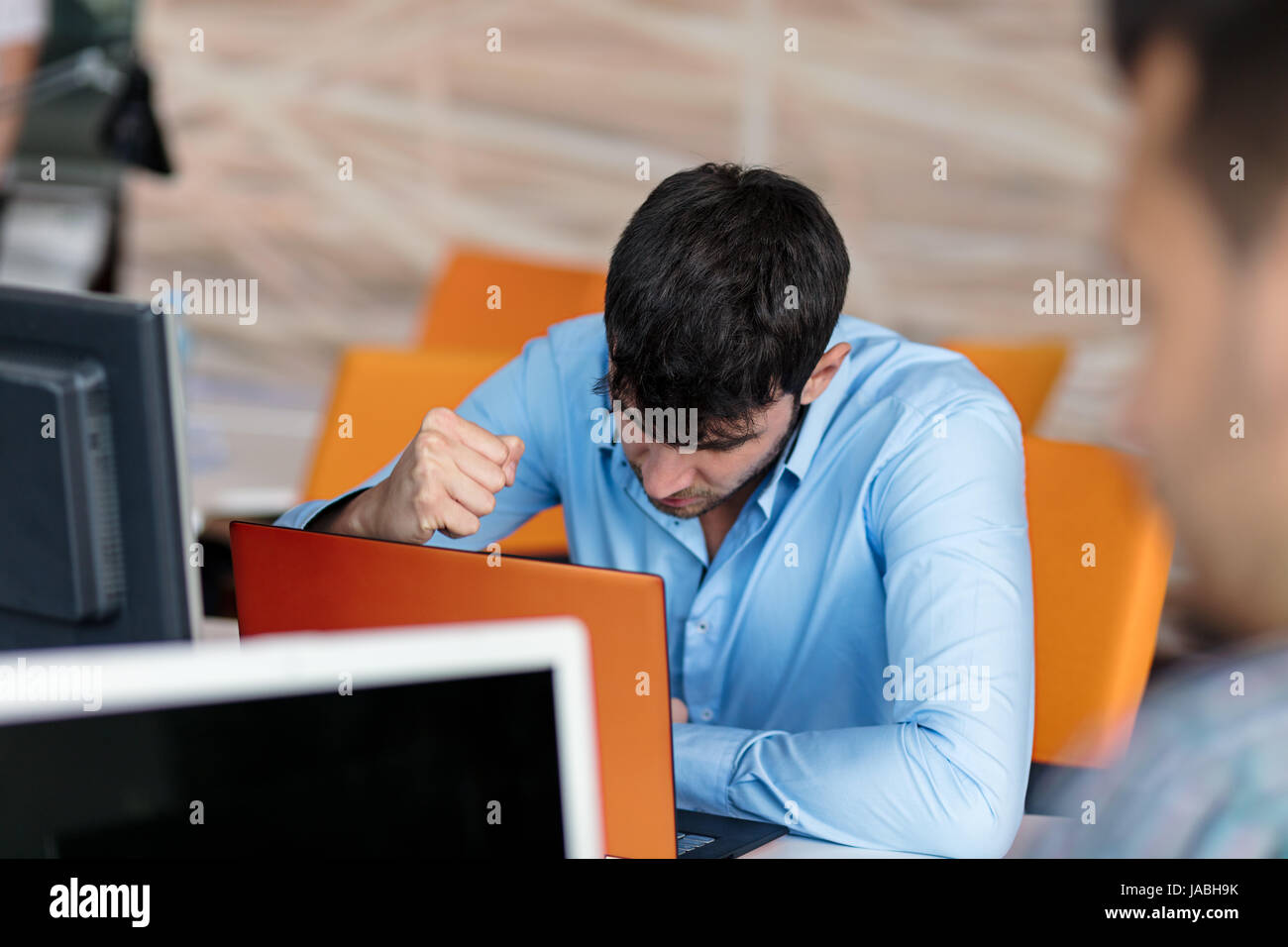 Worried businessman working at his desk in his office Stock Photo - Alamy