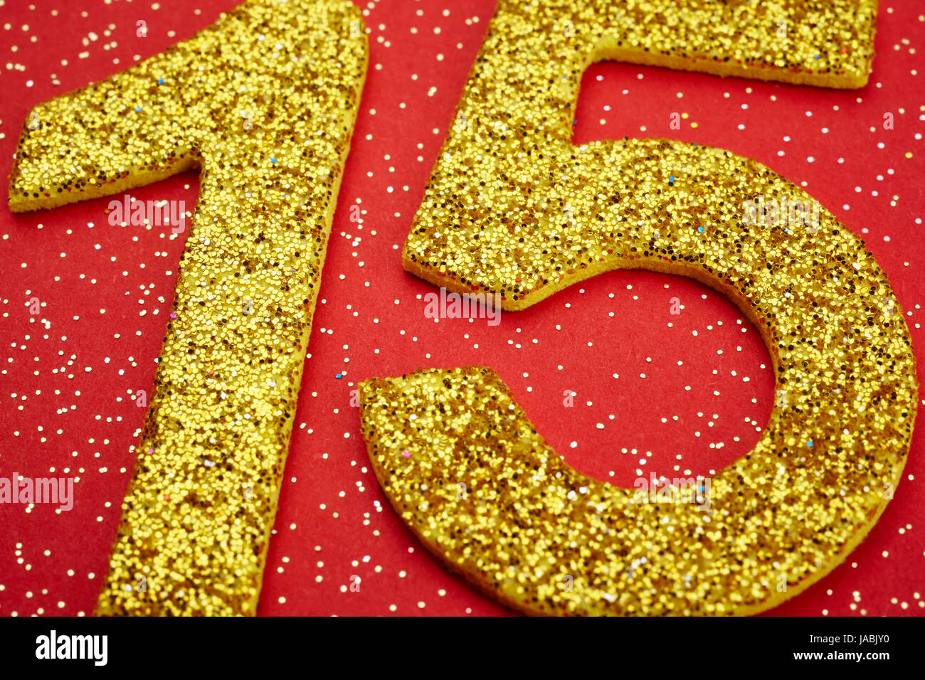 Number fifteen yellow color over a red background. Anniversary. Horizontal Stock Photo