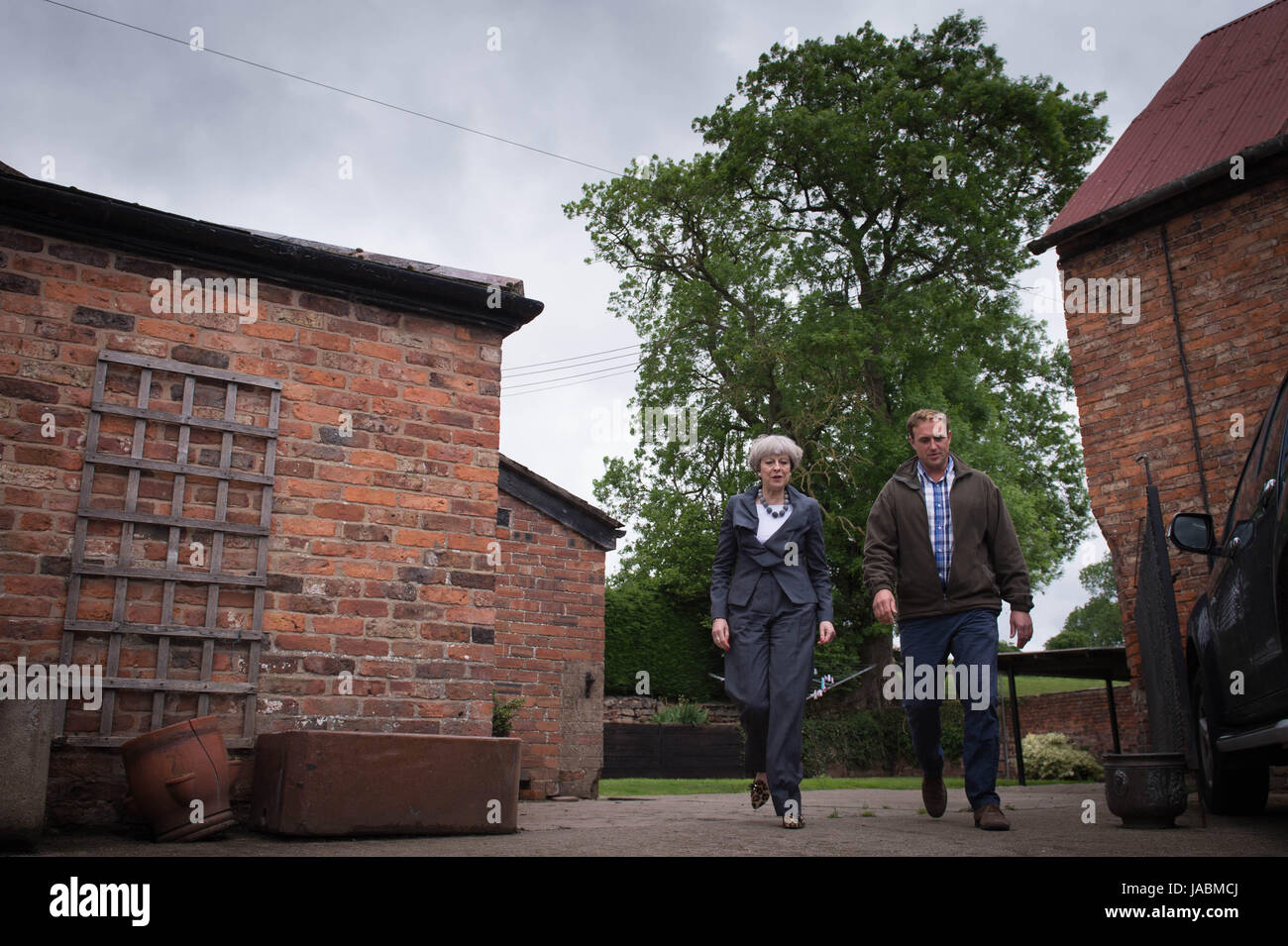 Prime Minister Theresa May meets the Dave Done family who runs the dairy and arable Royton Farm during her visit to Bangor while on the General Election campaign trail. Stock Photo