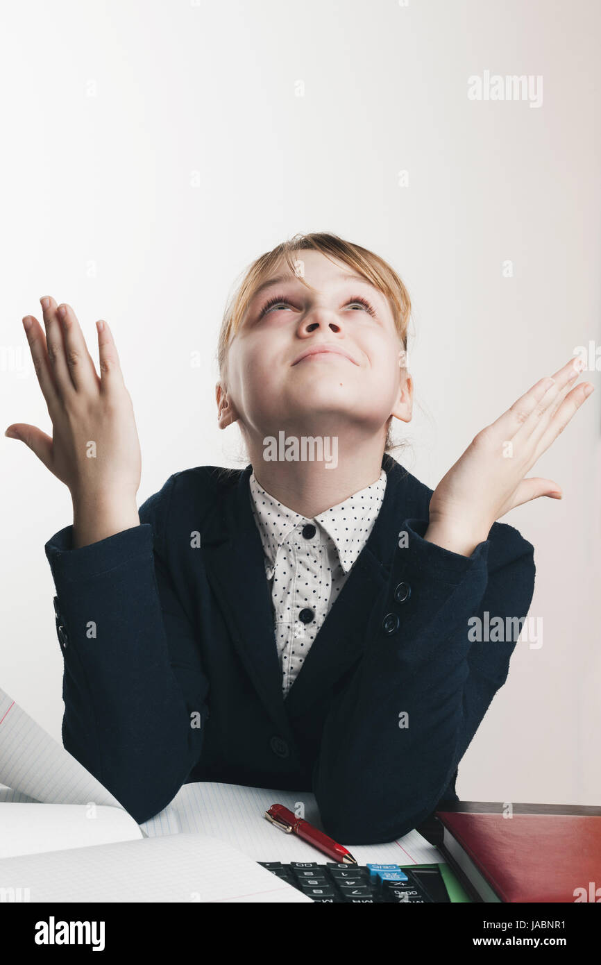 Stressed school girl, closeup portrait over white wall background Stock Photo
