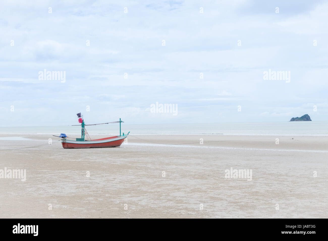 longtail boat on the beach over blue sky in cloudy day Stock Photo
