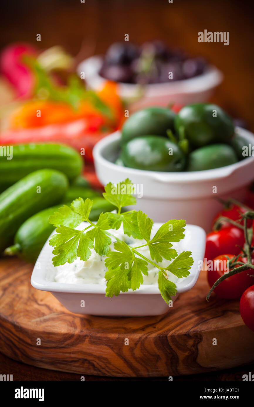 Antipasto and catering platter with wit raw vegetables and yogurt dip