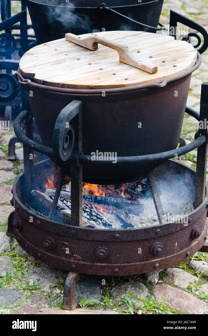 Old pot cooking over campfire hi-res stock photography and images - Alamy