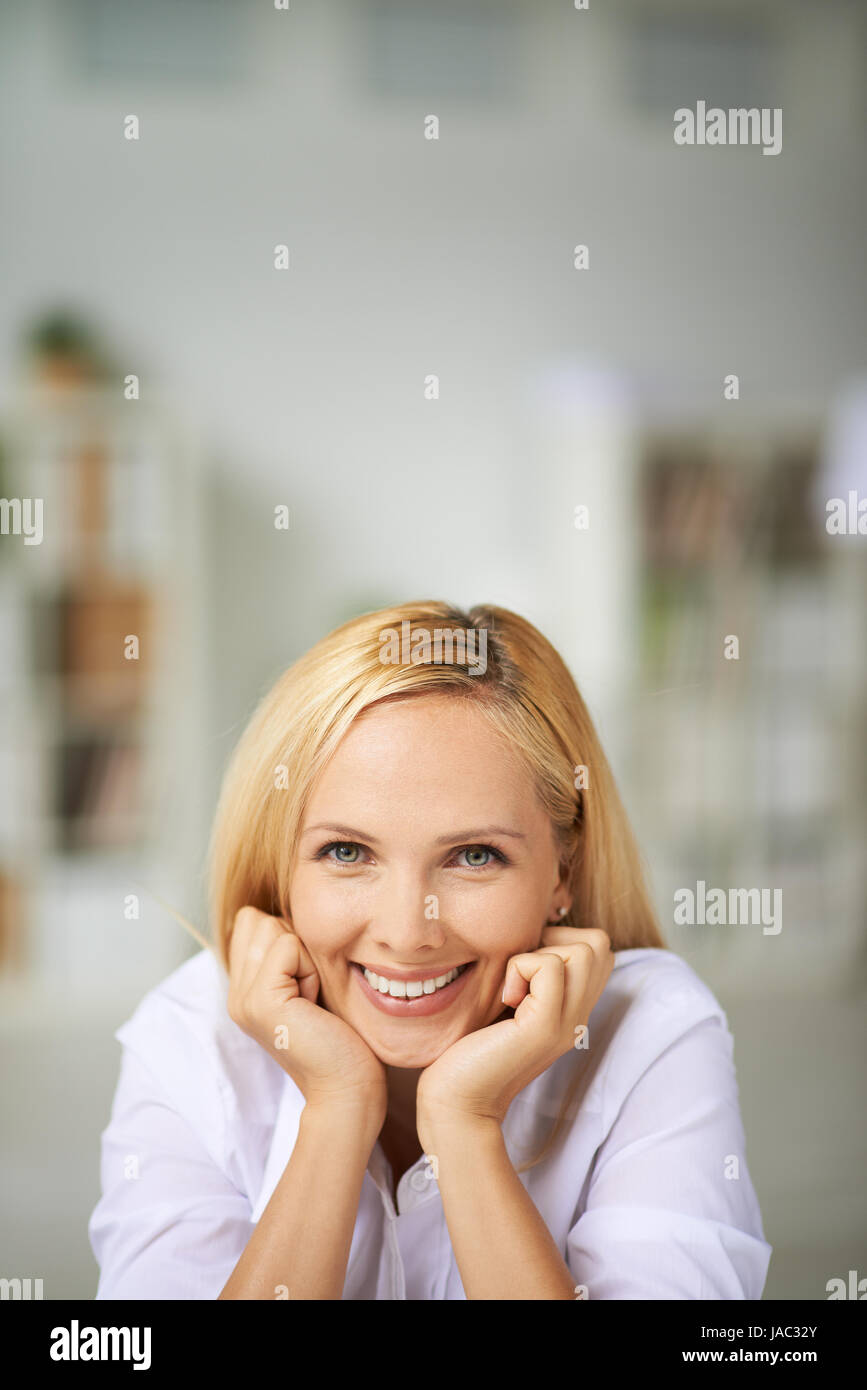 Happy girl looking at camera with toothy smile Stock Photo - Alamy