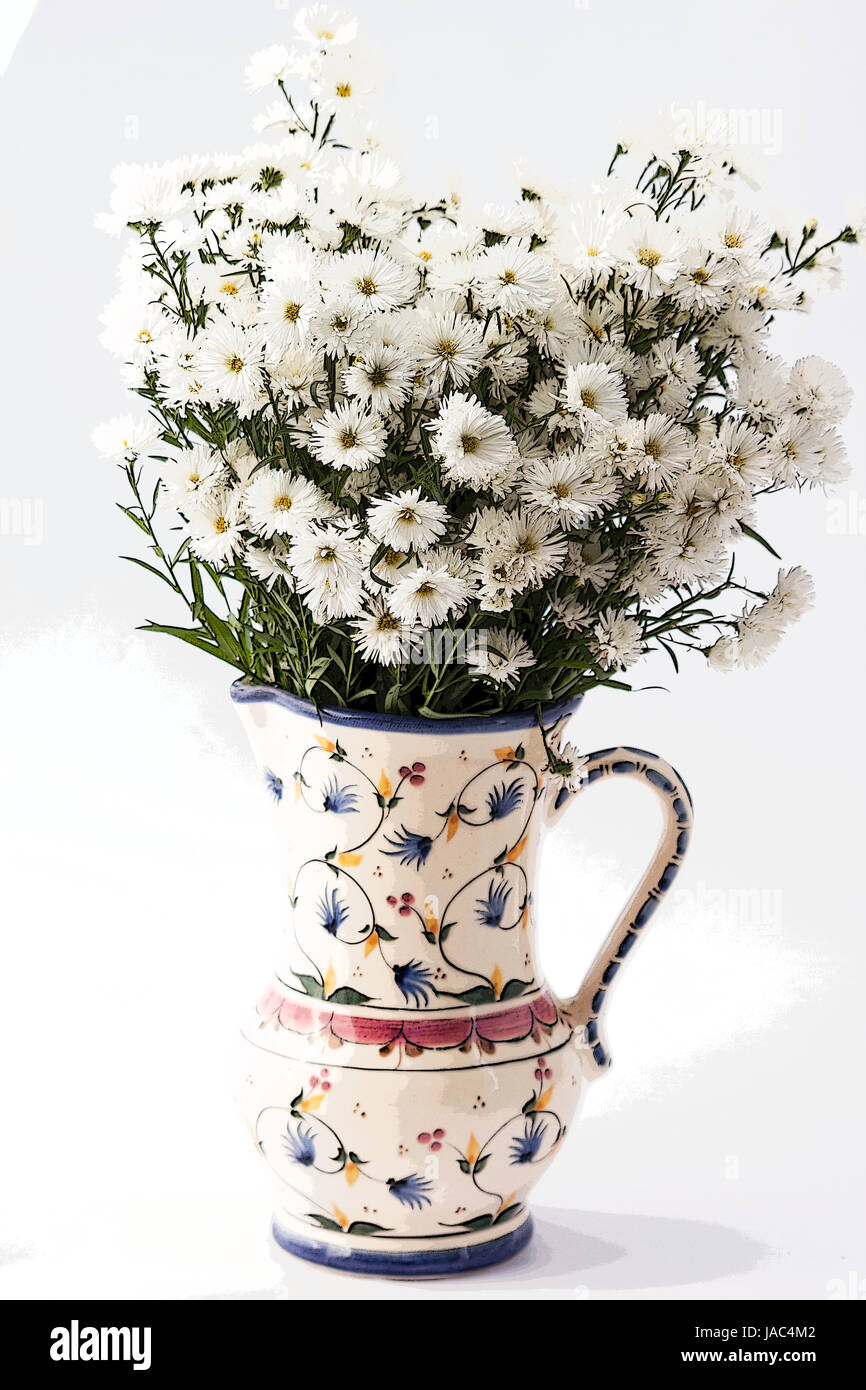 Vase with white flowers on white background Stock Photo - Alamy