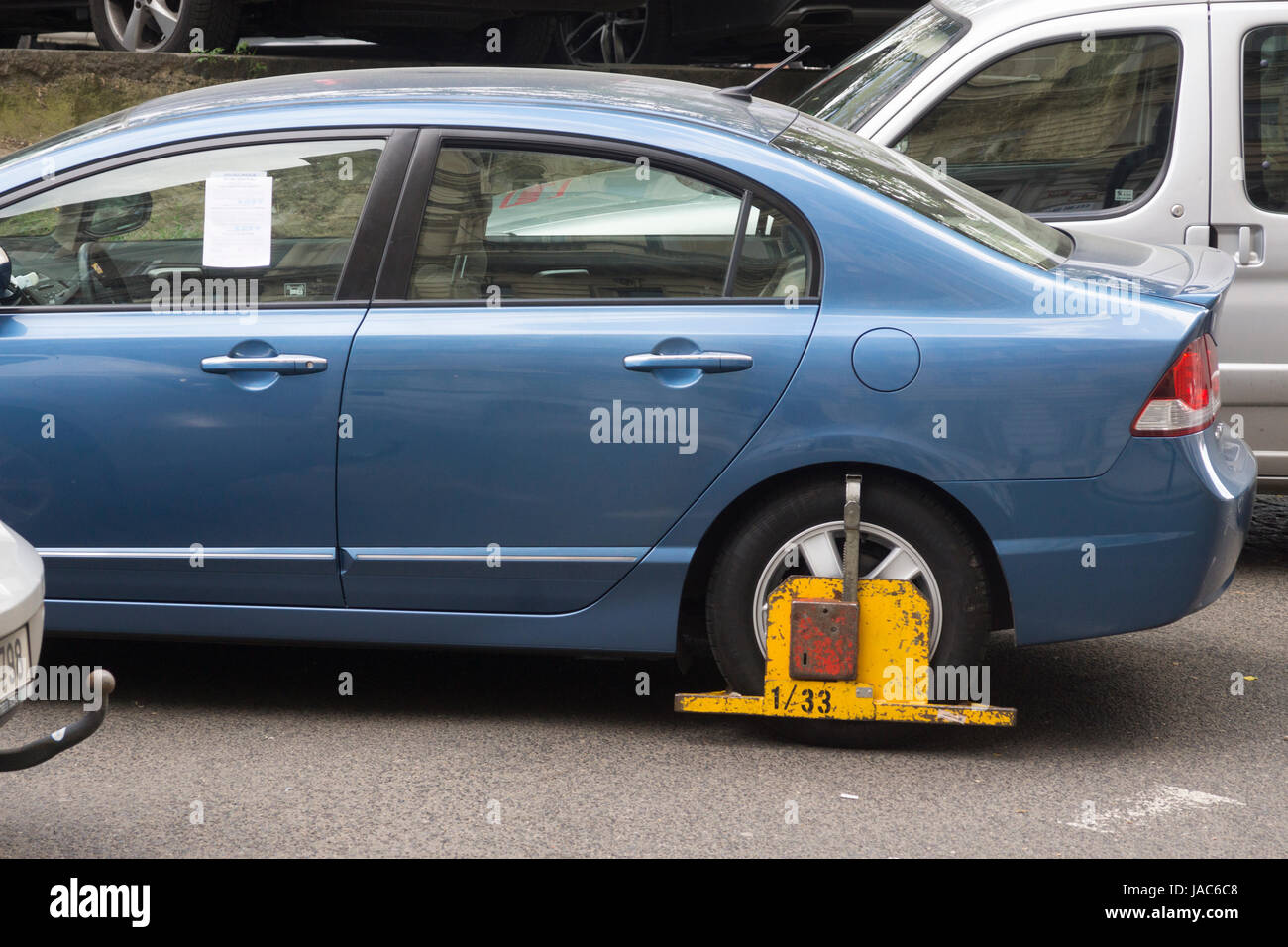 Visitors driving to Prague need to be careful to park correctly. Clamped cars near the National Museum Stock Photo