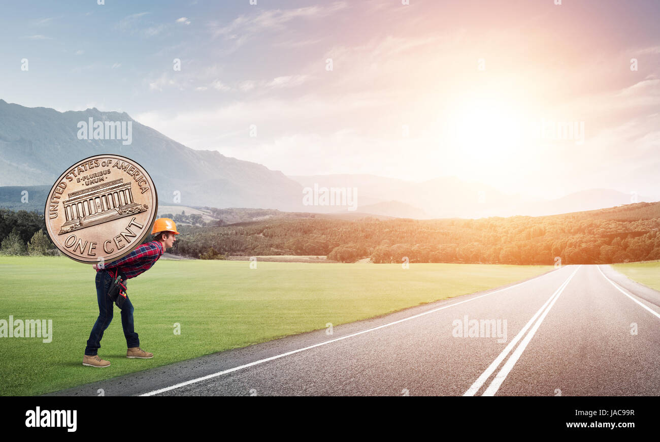 Builder man carry coin Stock Photo Alamy