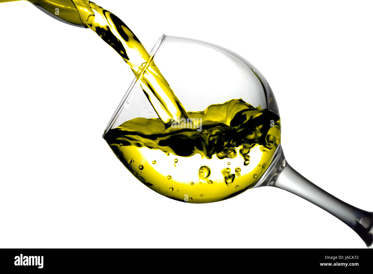Yellow liquid, water, apple juice, white wine pouring into a glass, liquid in a speaker, isolated on a white background Stock Photo