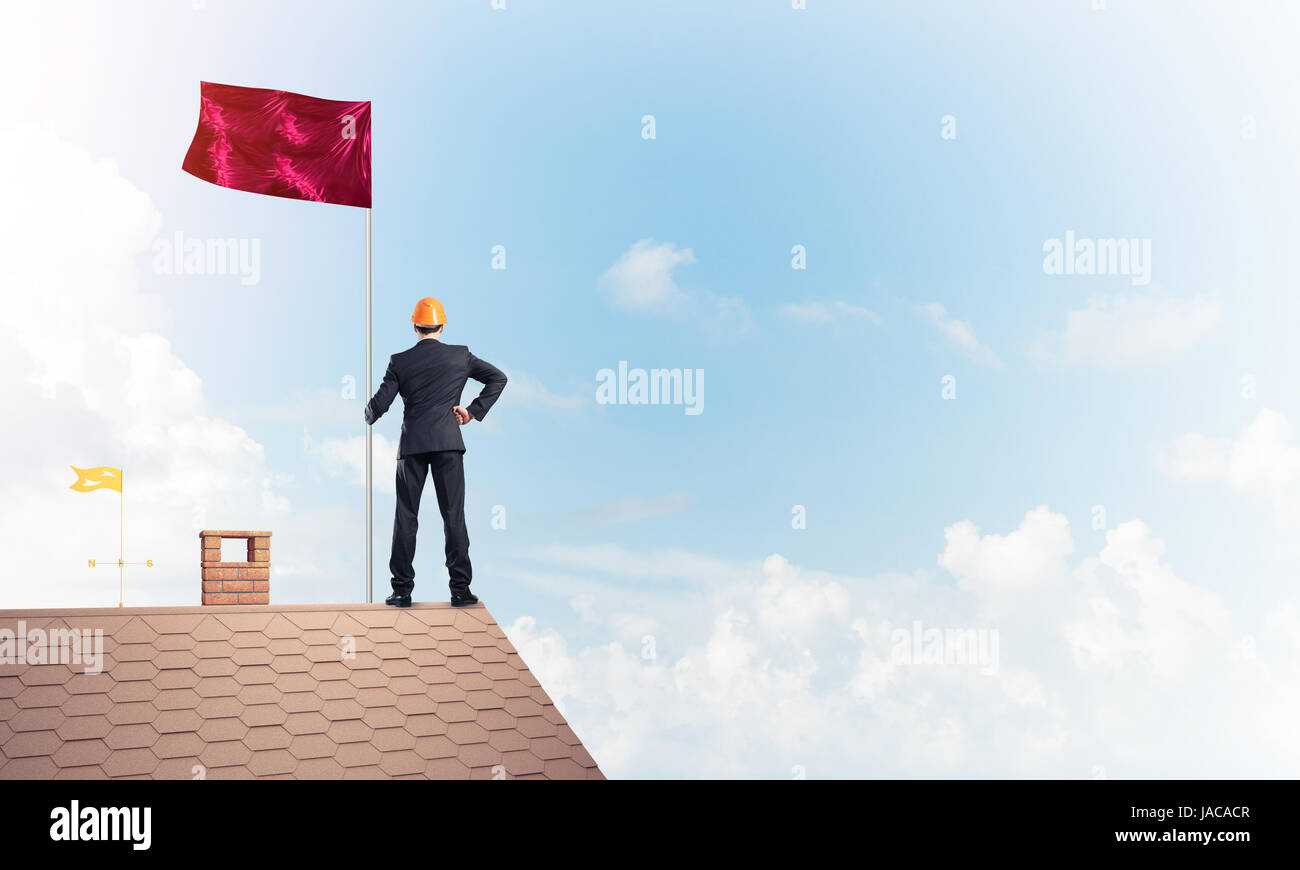 Young businessman with flag presenting concept of leadership. Mi Stock Photo