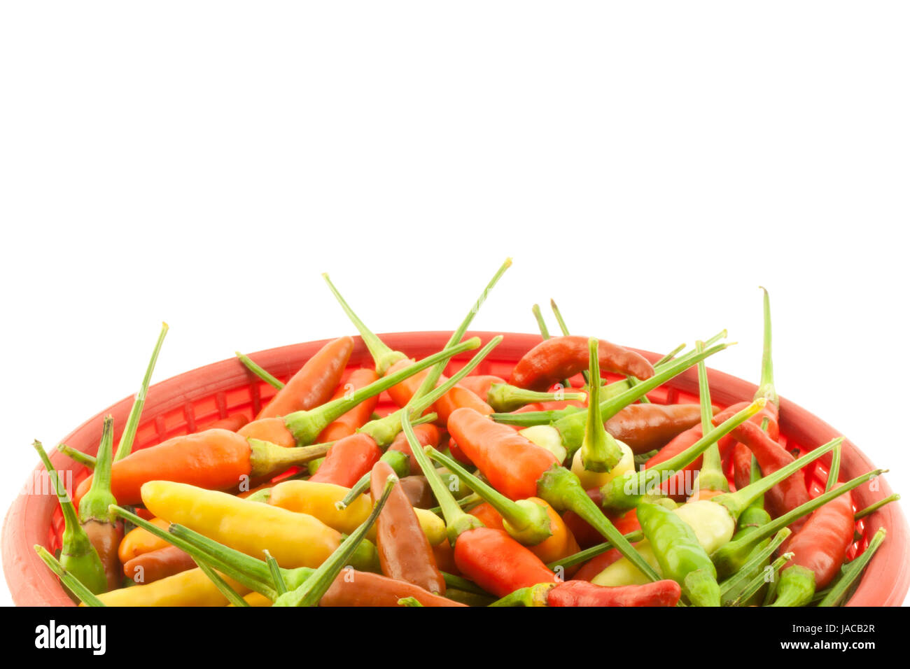Red, yellow, and green pepper on white background Stock Photo - Alamy