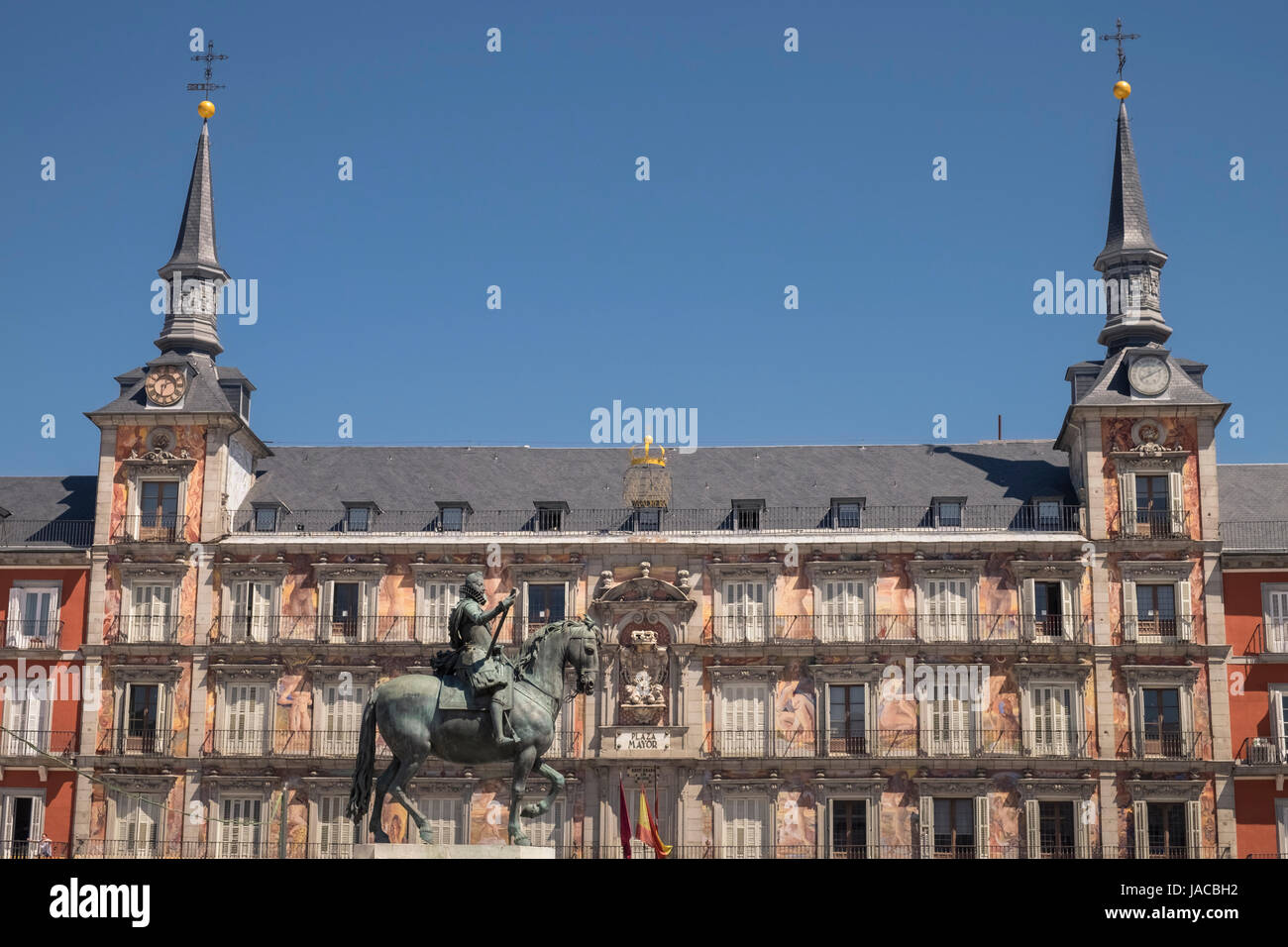 Bronze statue of King Philip III, surrounded by three storey houses with balconies, in the centre of Plaza Major, Madrid, Spain. Stock Photo