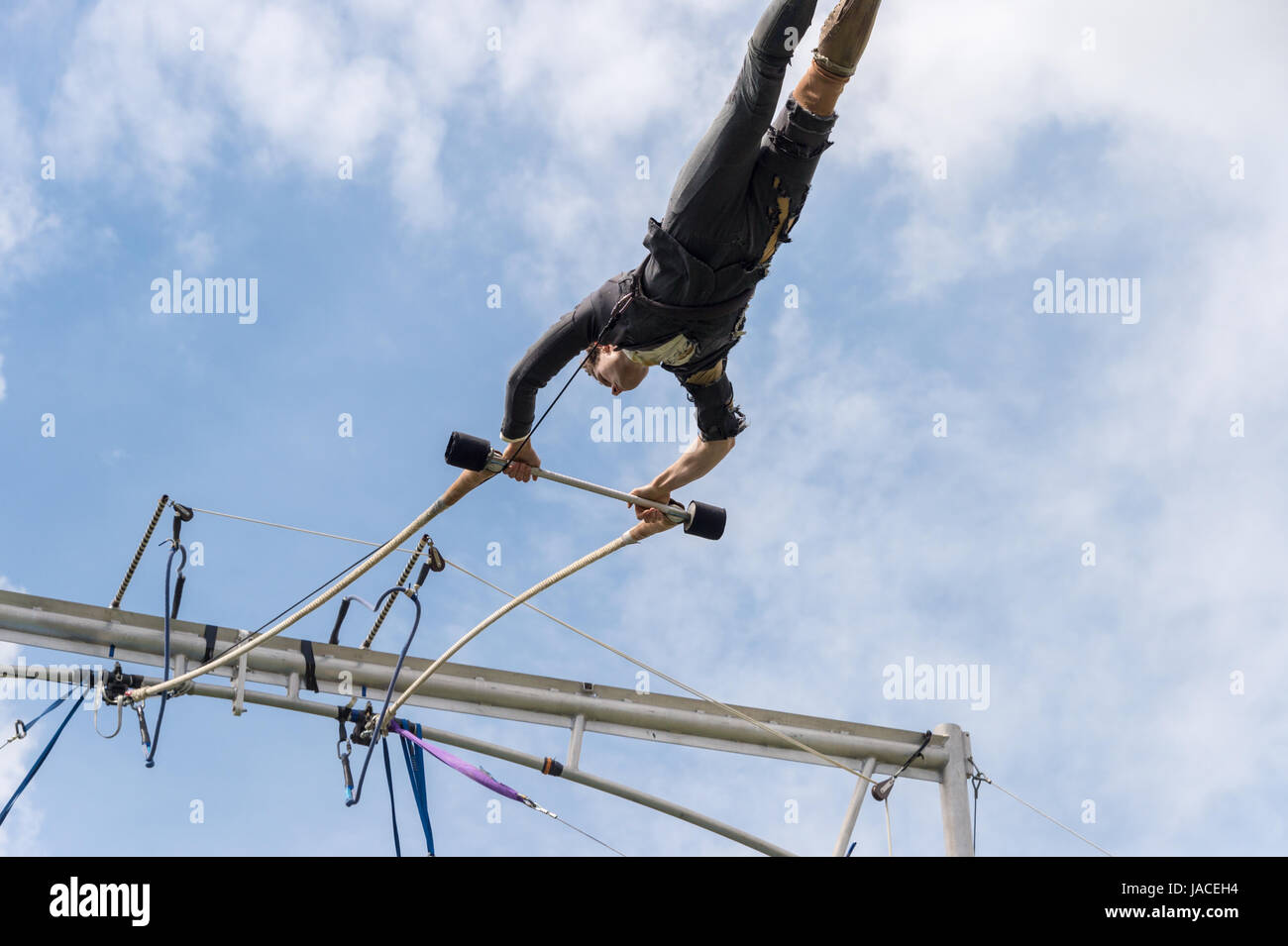 Montreal, Canada - 4 June 2017: Trapeze artist performing outside In Jeanne Mance Park Stock Photo