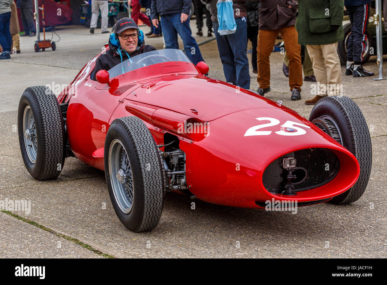 1957 Maserati 250F drives through the paddock before the Brooks Trophy race at the Goodwood GRRC 74th Members Meeting, Sussex, UK. Stock Photo