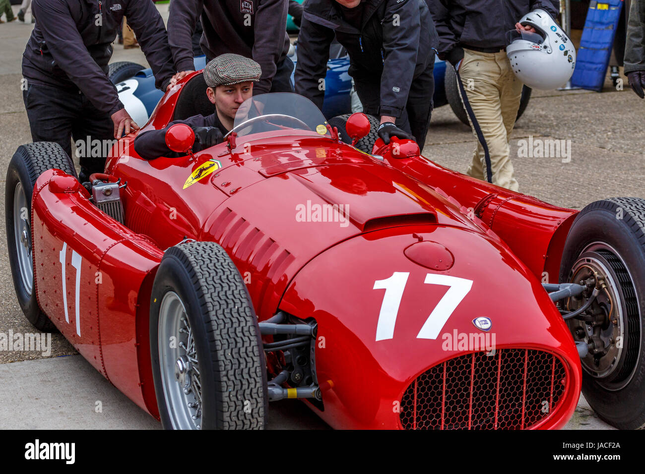 1954 Lancia D50 is pushed through the paddock for the Brooks Trophy race, Goodwood GRRC 74th Members Meeting, Sussex, UK. Stock Photo