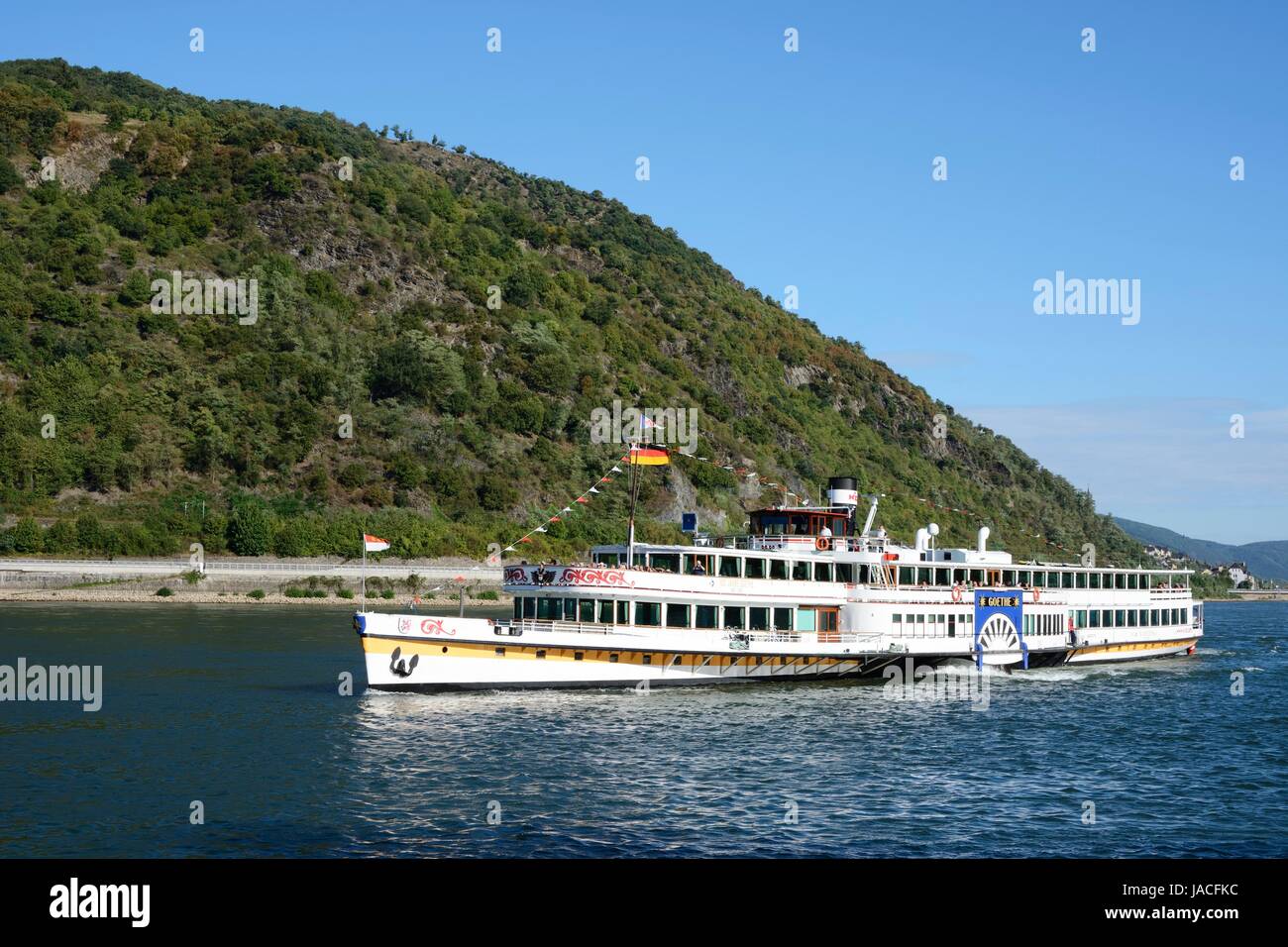 BACHARACH, GERMANY - SEPTEMBER 2: Tourists making a ship round trip on the river Rhine in Bacharach, Germany on September 2, 2013. The ship Goethe of the KD river cruise company is over 100 years old. Foto taken from the port with view accross the Rhine. Stock Photo
