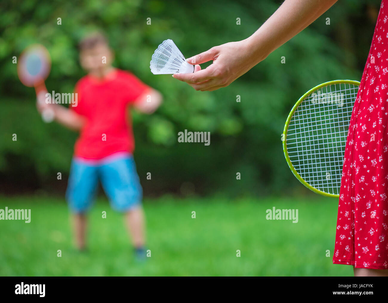 Boy and girl playing badminton Stock Photo