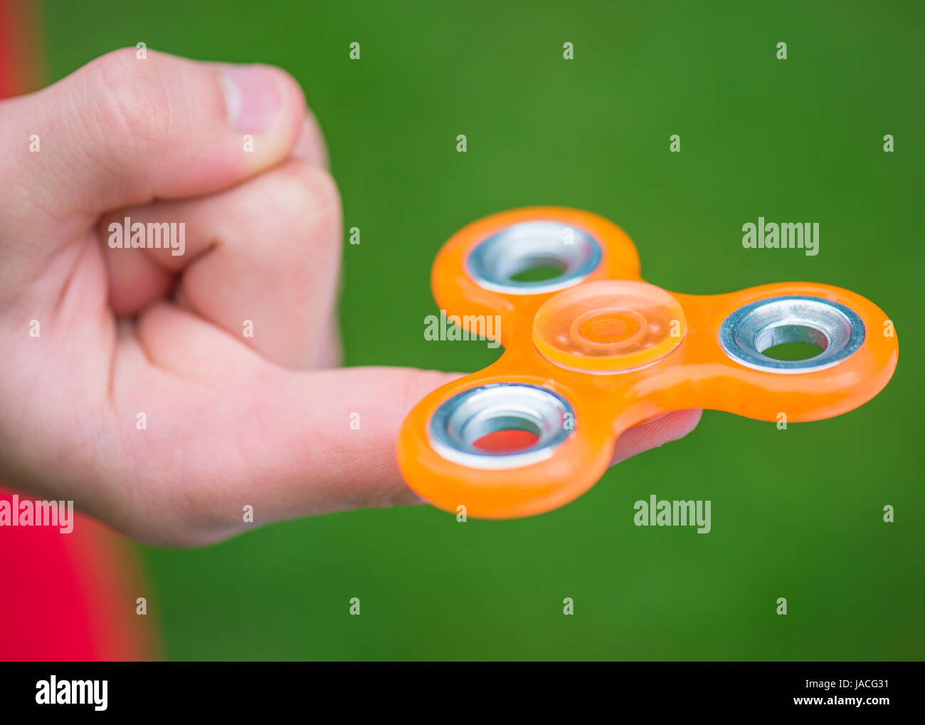 Hand with spinner toy Stock Photo
