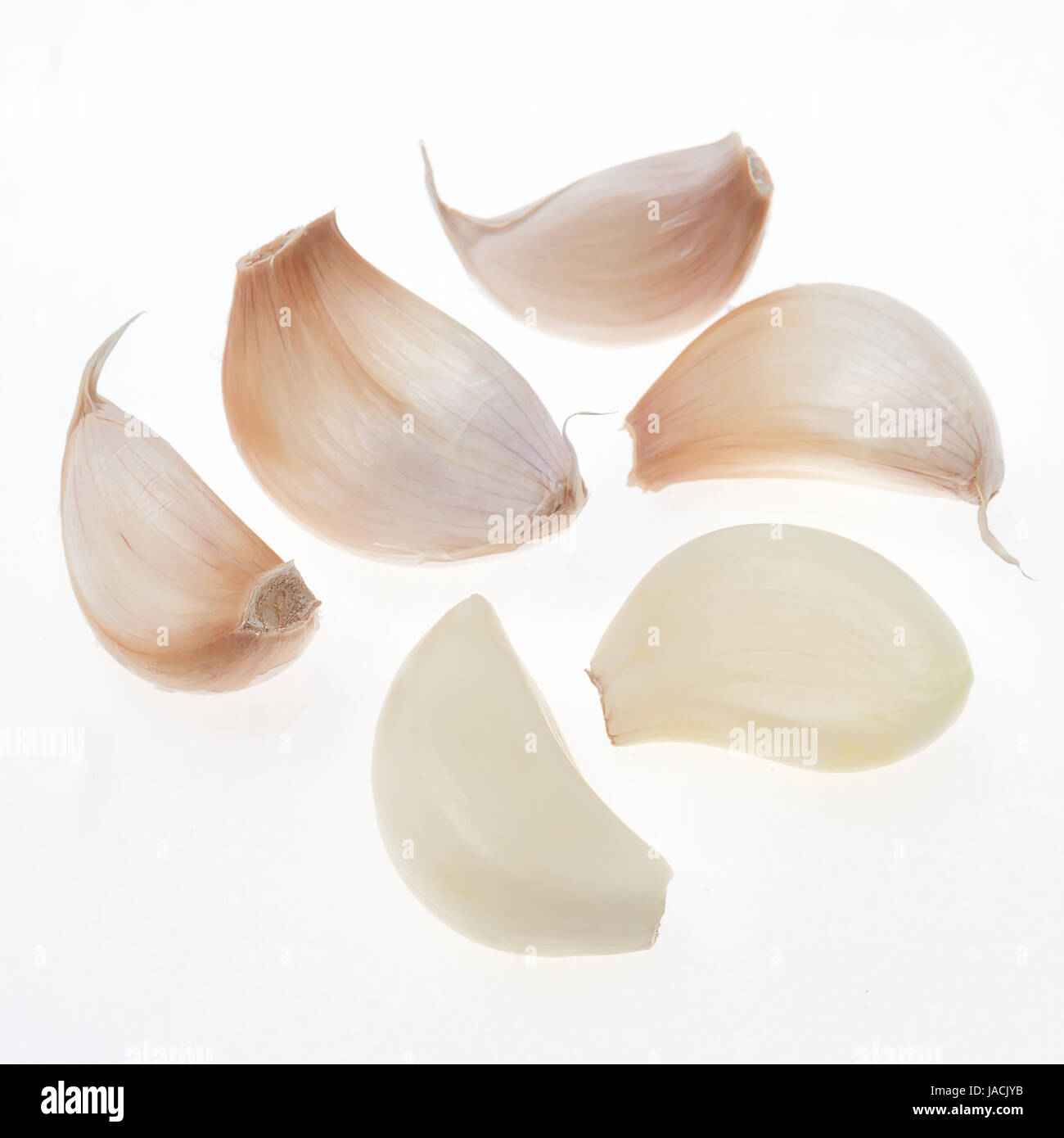 Garlic cloves isolated on white background Stock Photo - Alamy