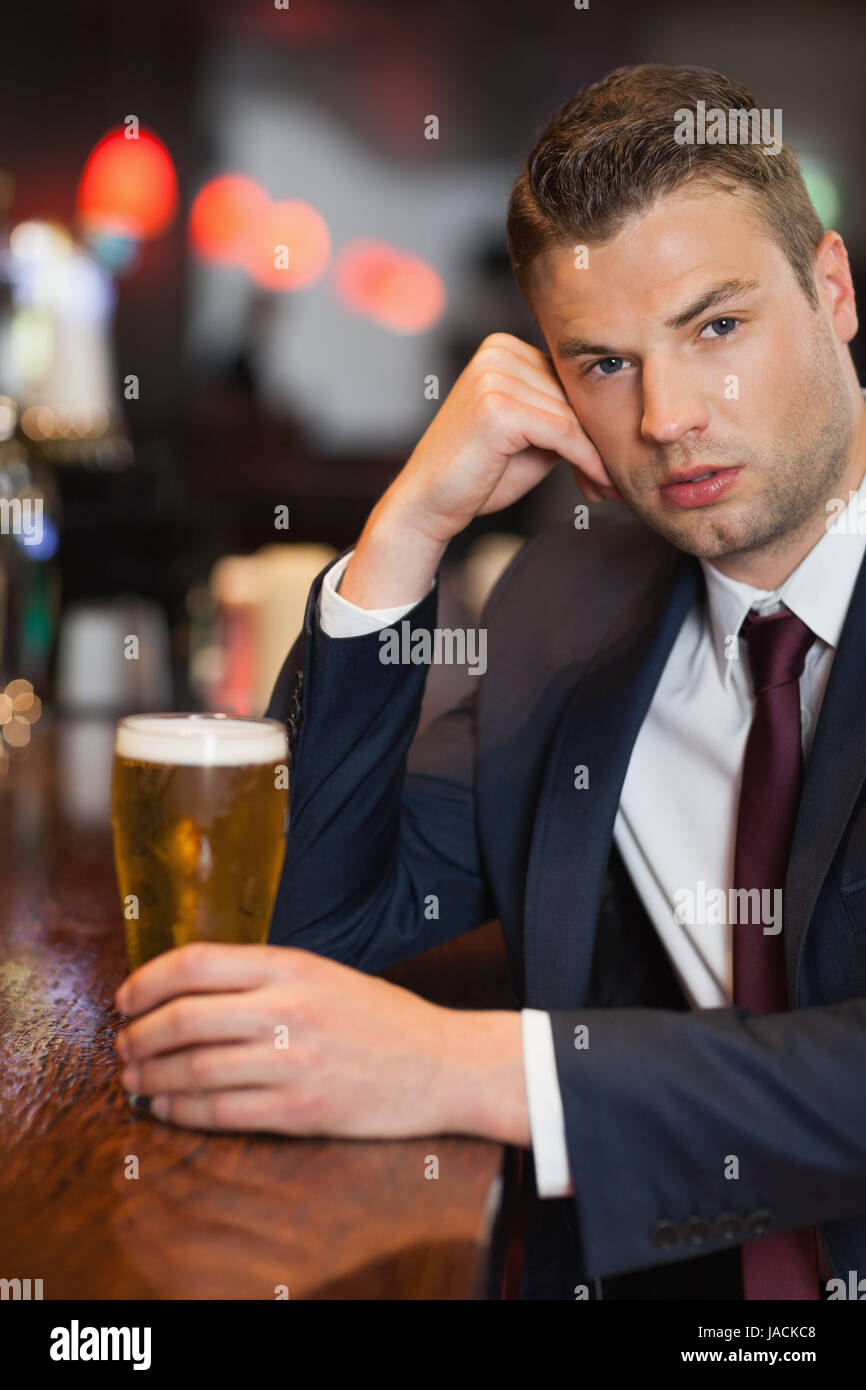 Attractive sad man sitting bar hi-res stock photography and images - Alamy