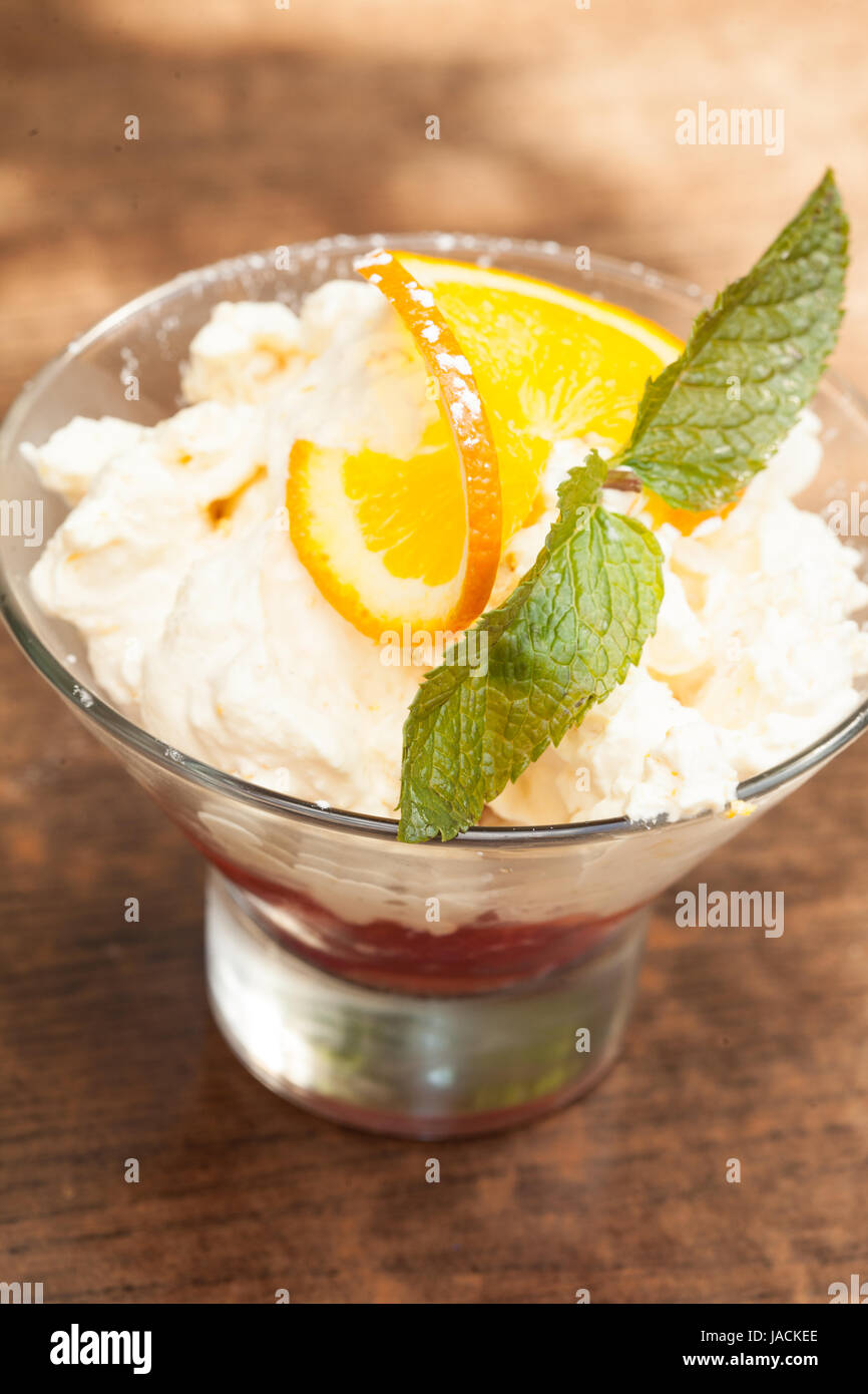 Close up on a delicious lemon sorbet with mint leaf garnish served in