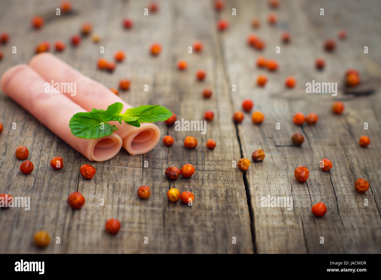 Fresh ham rolls with a mint leaf on wood background Stock Photo