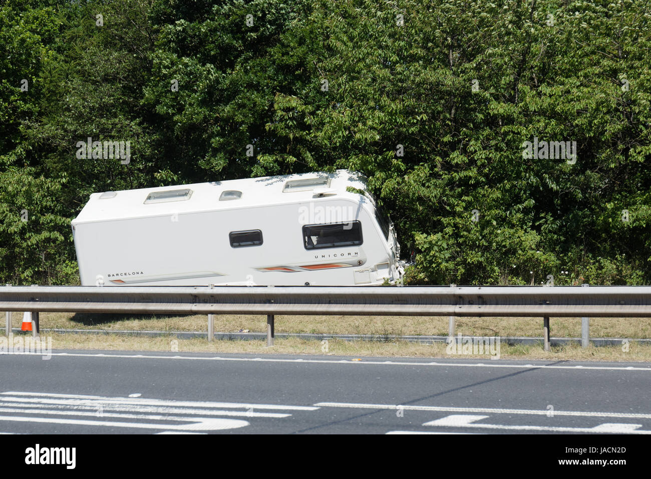 This caravan unhitched itself coming around a bend, and went up the embankment. Stock Photo