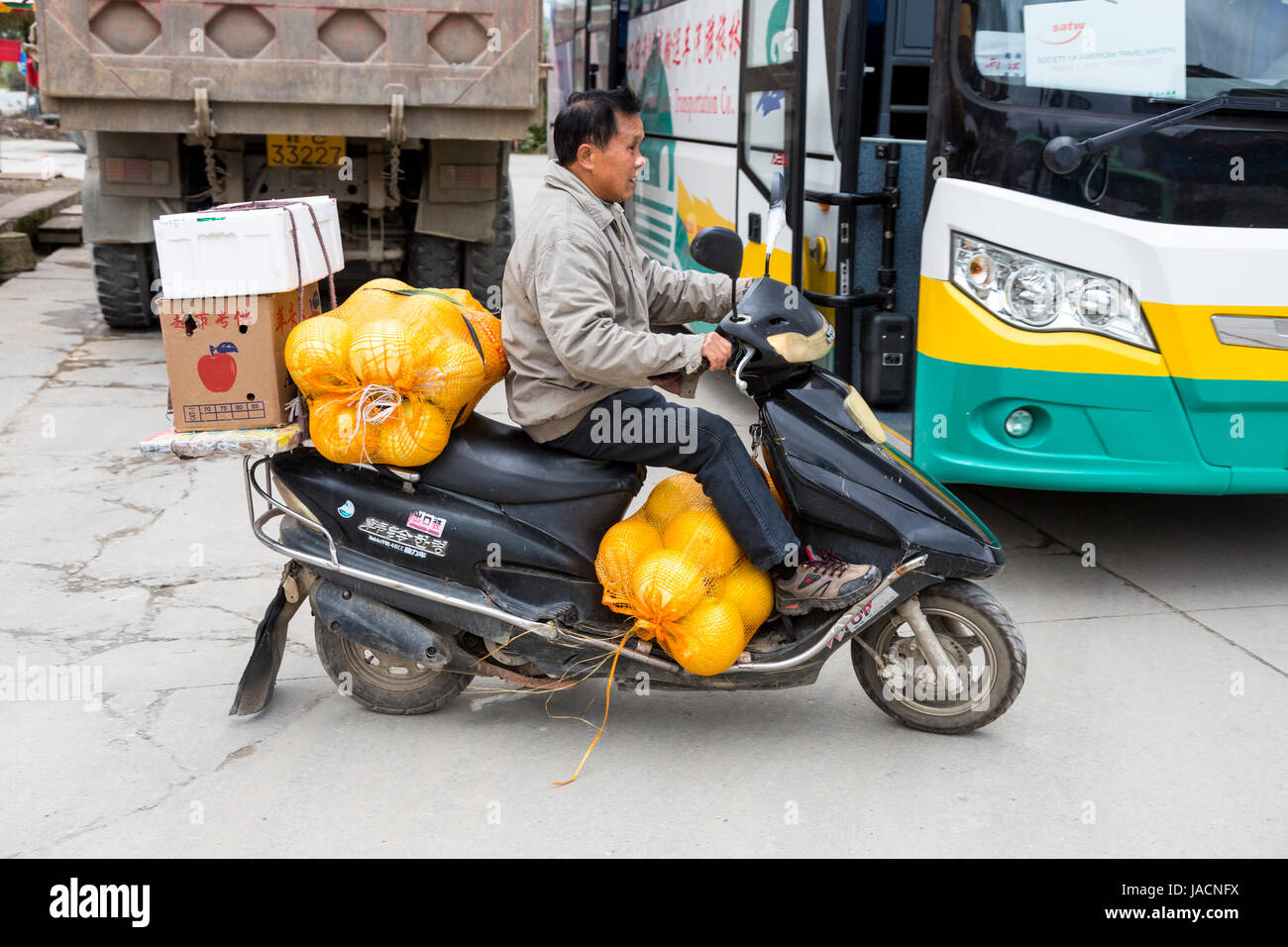 Yangshuo, China.  Motorbike Transporting Pomelos. Stock Photo