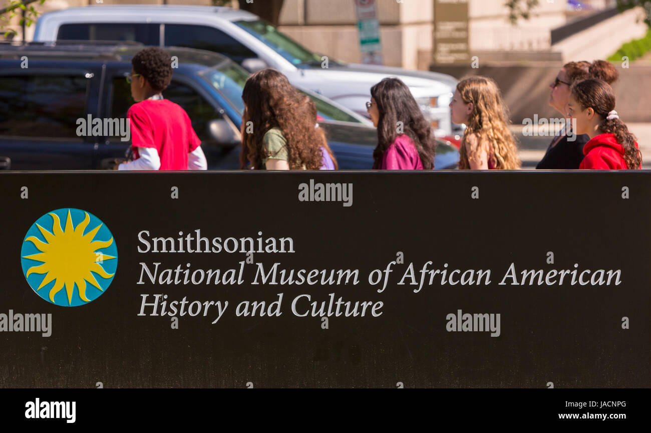 WASHINGTON, DC, USA - Smithsonian National Museum of African American History and Culture sign and people. Stock Photo