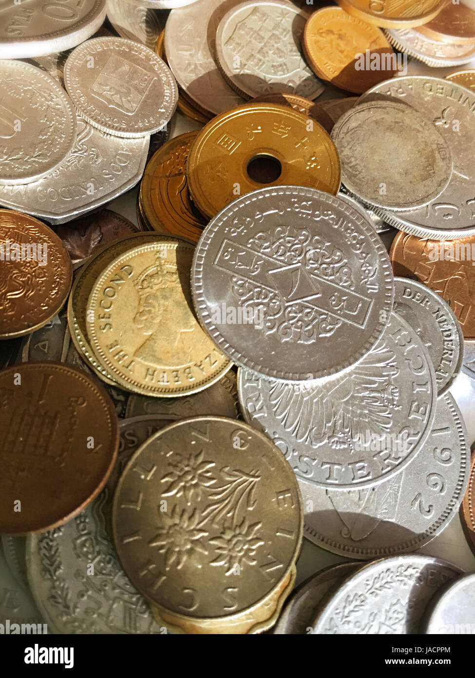 Cache of International Coins Stock Photo - Alamy