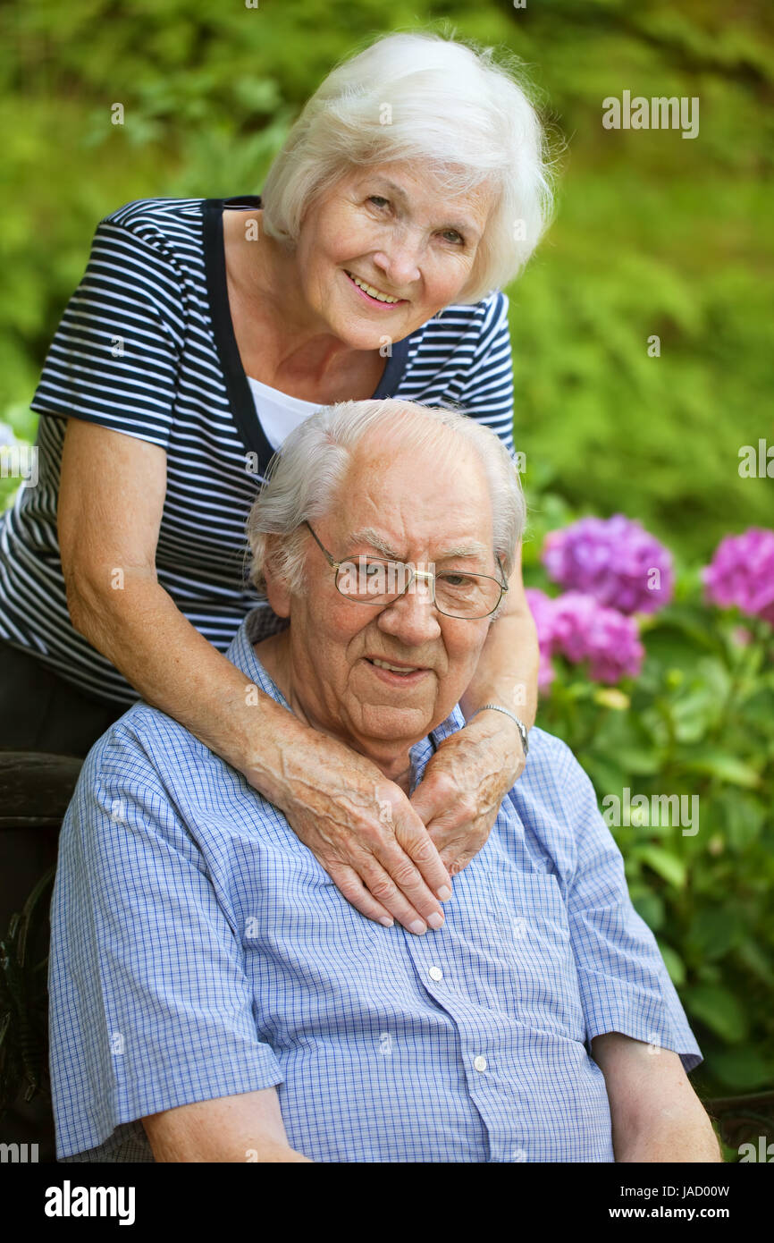 Happy senior couple in the garden Stock Photo - Alamy
