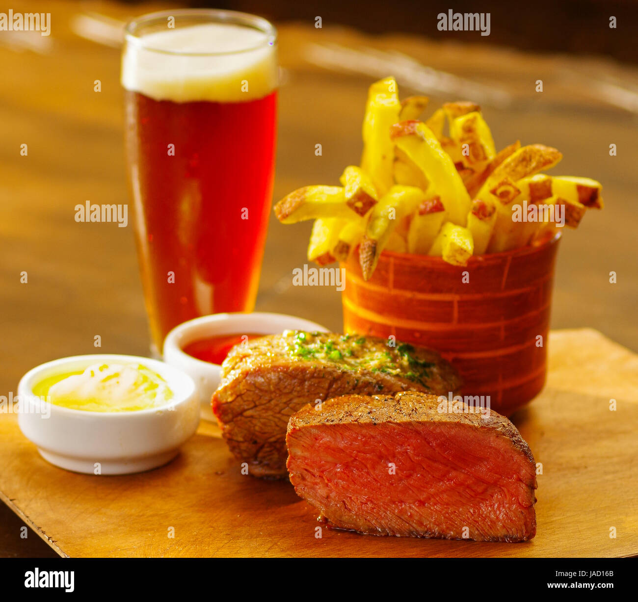 Welldone grilled marinated beef flank steak with ketchup, mustard