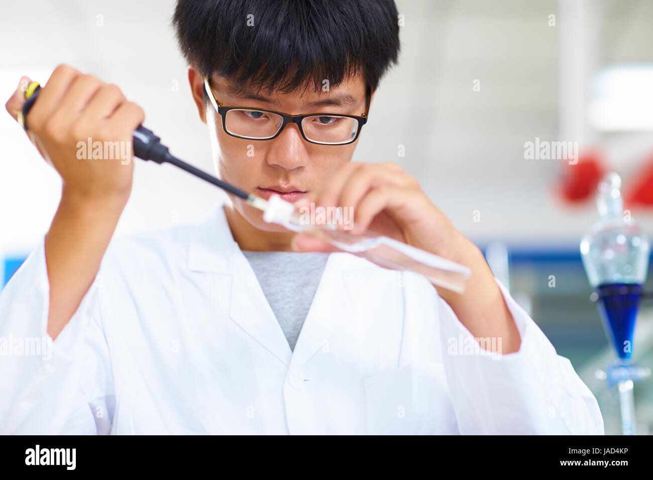 One male Chinese Laboratory scientist working at lab with test tubes Stock Photo